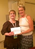 Photo of Teri Egner, Program Field Representative in Employment Support Services at the Oklahoma Department of Rehabilitation Services, winning an iPad Mini at the 2015 APSE National Conference in Philadelphia, PA.