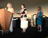 Photo of Ph.D. student Julie Christensen winning the Got Mike! Fund Educational Leadership Award at the APSE 2013 Conference