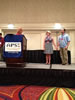 Photo of Ph.D. student Nancy Molfenter winning the Got Mike! Fund Educational Leadership Award at the APSE 2012 Conference